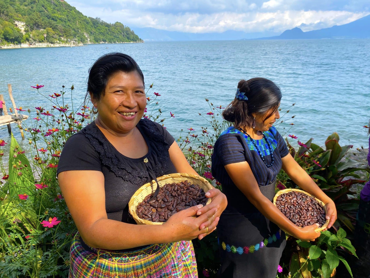 Mayan women holding cacao beans at Lake Atitlan Guatemala